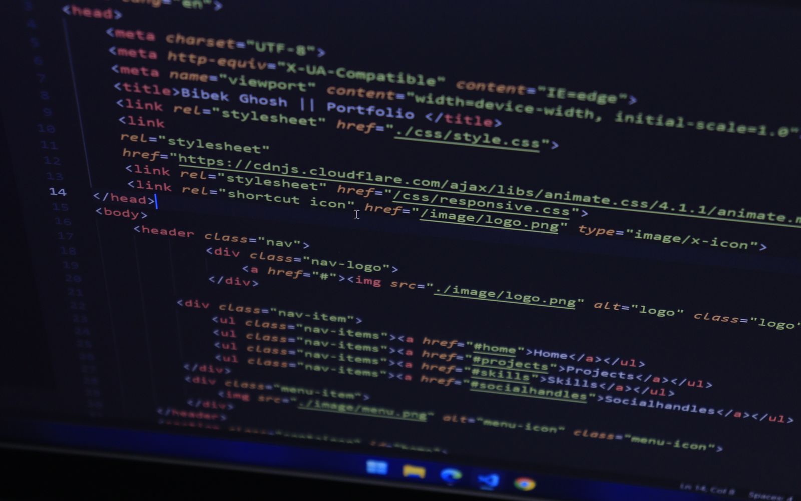 High-resolution close-up of HTML code displayed on a computer screen, perfect for technology themes.